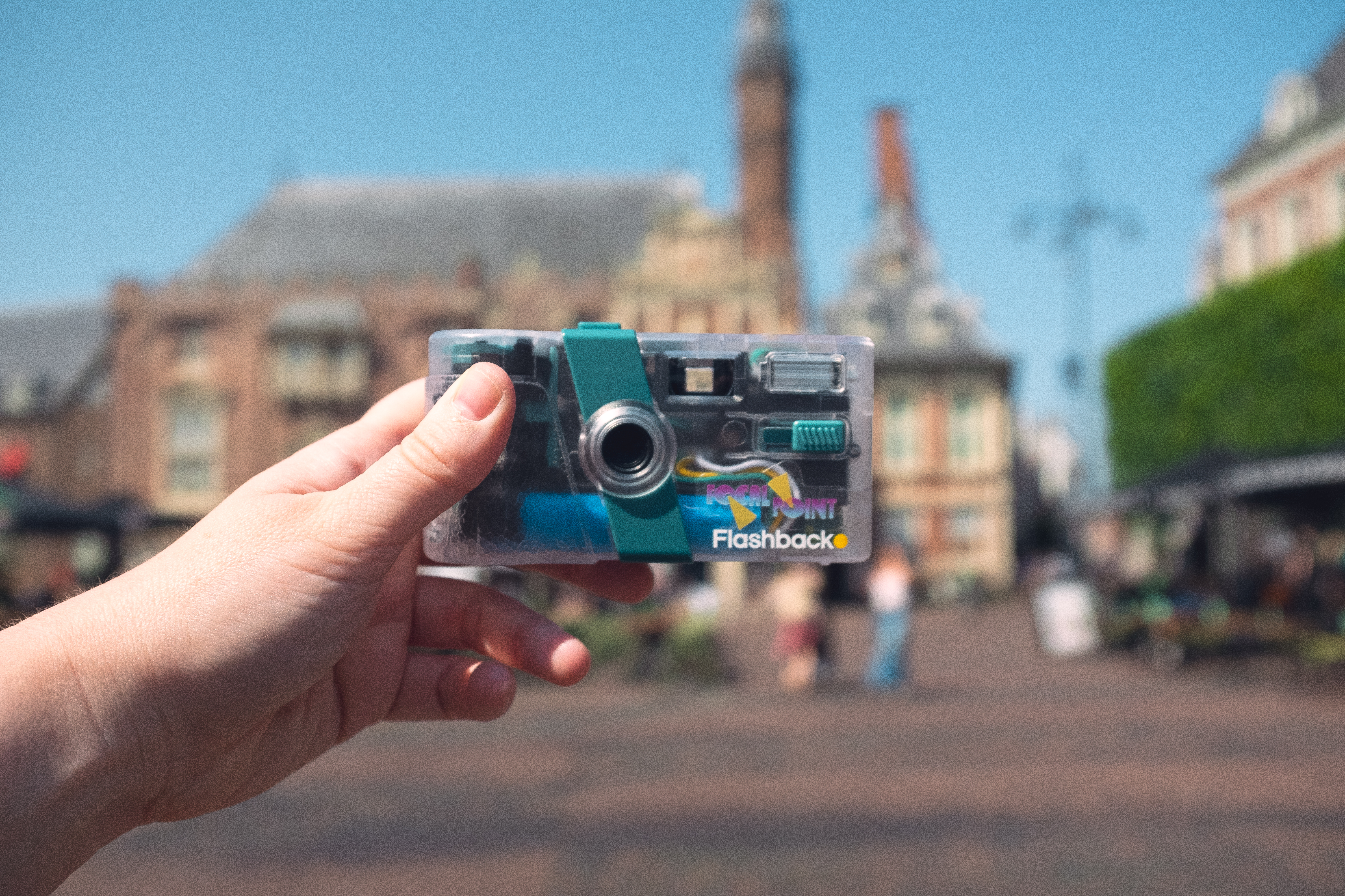 The Flashback ONE35 V2 camera used for NomadCam, held up on a street in Haarlem, Netherlands